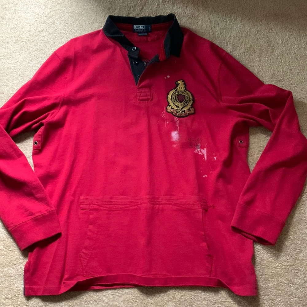 Polo, rugby style, pullover. Distressed designs, pocket on front